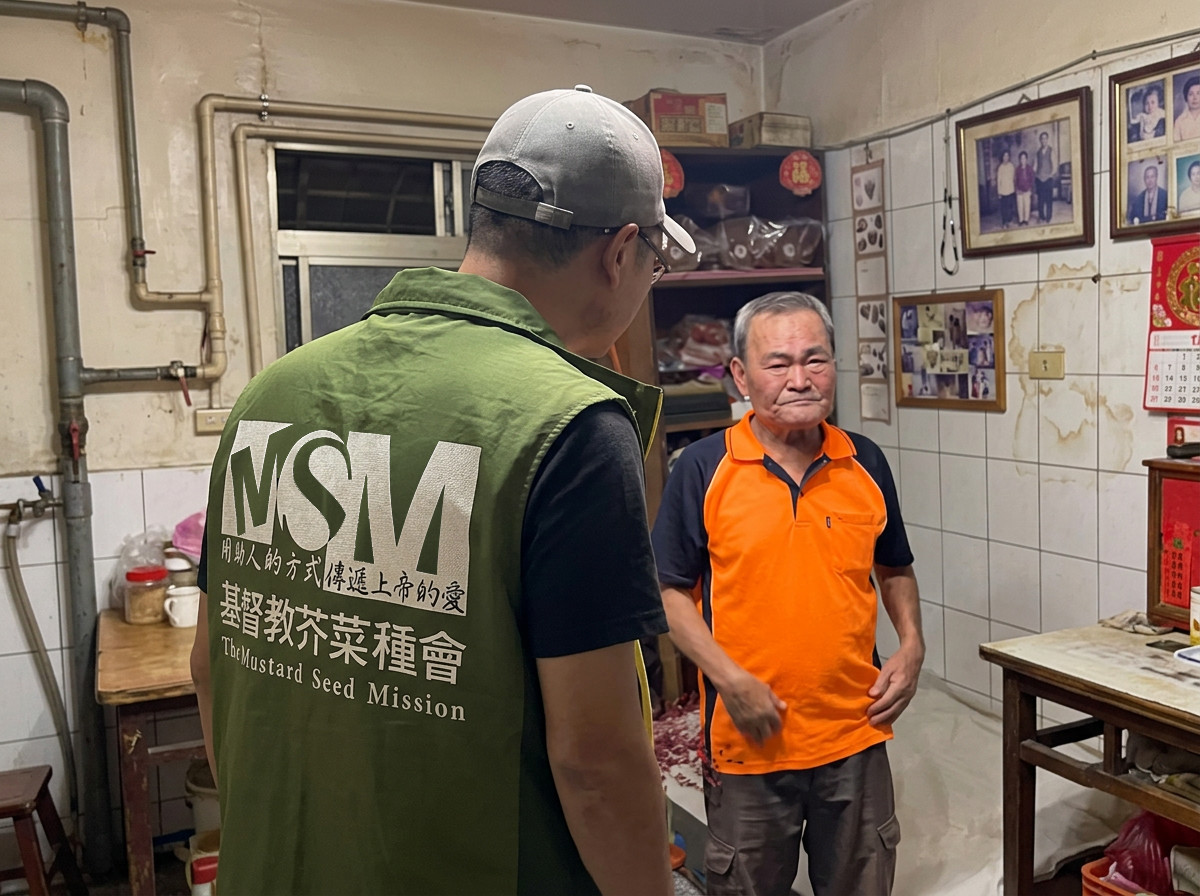 MSM social worker visiting Grandfather Chen — delivering mattress and relief supplies after the flood