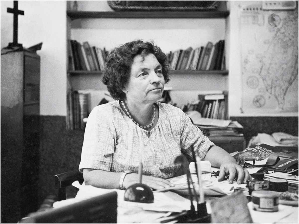 Archival photograph of Lillian Dickson working at her desk in Taiwan